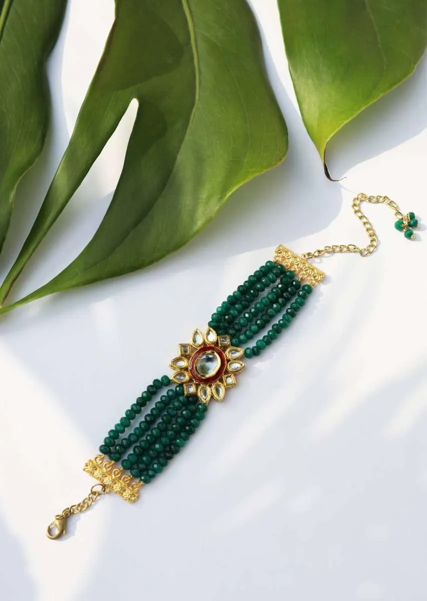 Gold Plated Kundan Bracelet With Emerald Green Stones Bead Strings And Mina Kari Detailing On The Edges By Paisley Pop